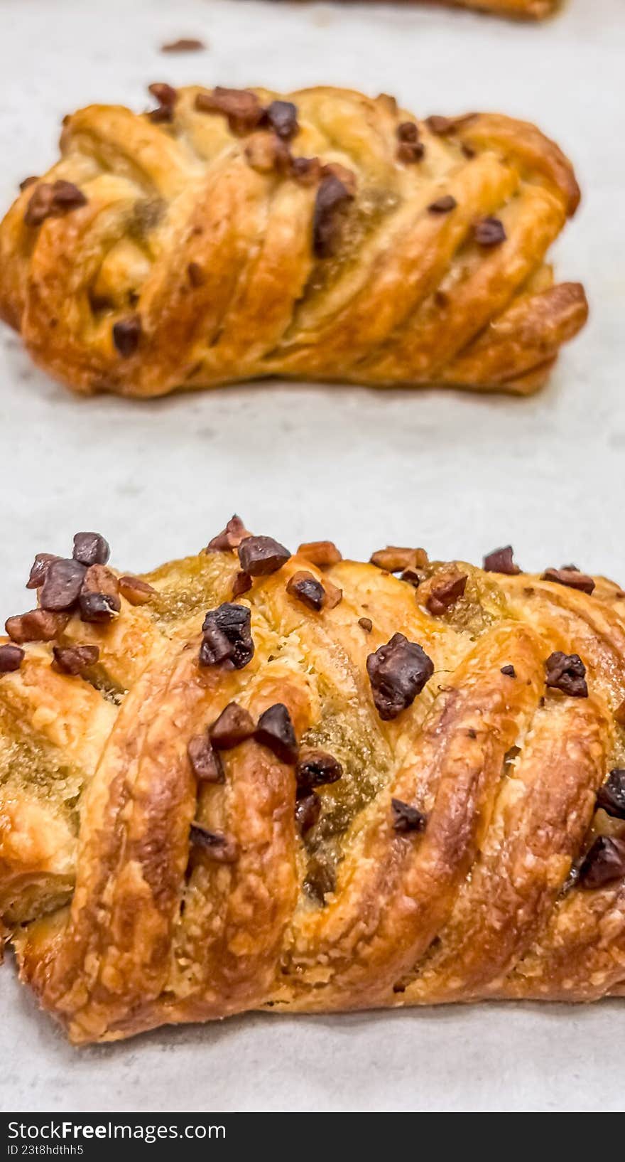 A high-angle, close-up shot of a gourmet savory pastry featuring a beautiful golden-brown lattice crust. Served on a clean white plate, the pastry's flaky texture and professional bake make it ideal for cafe menus, bakery branding, food blog recipes, or artisanal catering marketing.