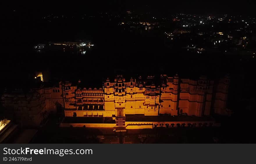 Aerial Night View of the Illuminated City Palace in Udaipur, Rajasthan, India