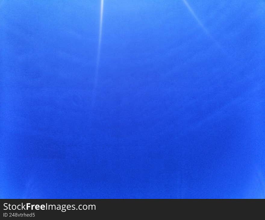 The image is of a blue sky with cirrus clouds
