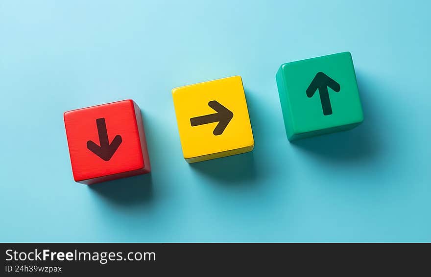 Colorful wooden cubes with arrows pointing in different directions, choice and decision concept