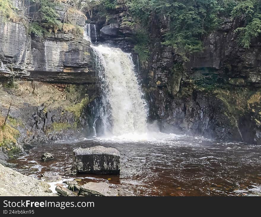 Scenic view of a waterfall along the Ingleton Waterfalls Trail in Yorkshire, England. Natural landscape featuring cascading water, mossy rocks, forest surroundings, and a peaceful outdoor atmosphere. Popular hiking destination showcasing British nature, ideal for travel, nature. Scenic view of a waterfall along the Ingleton Waterfalls Trail in Yorkshire, England. Natural landscape featuring cascading water, mossy rocks, forest surroundings, and a peaceful outdoor atmosphere. Popular hiking destination showcasing British nature, ideal for travel, nature.