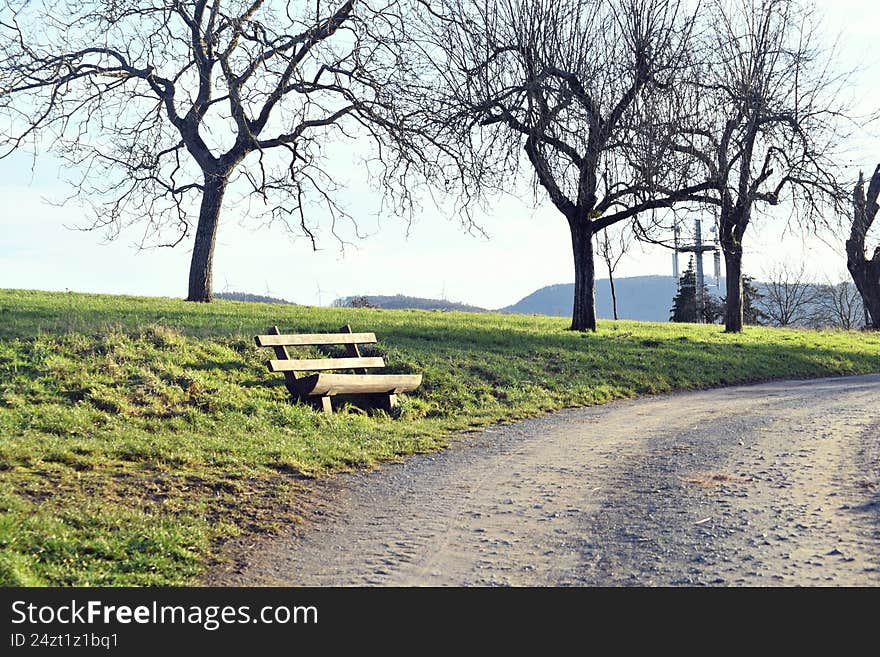wooden bench on the promenade near reichelsheim