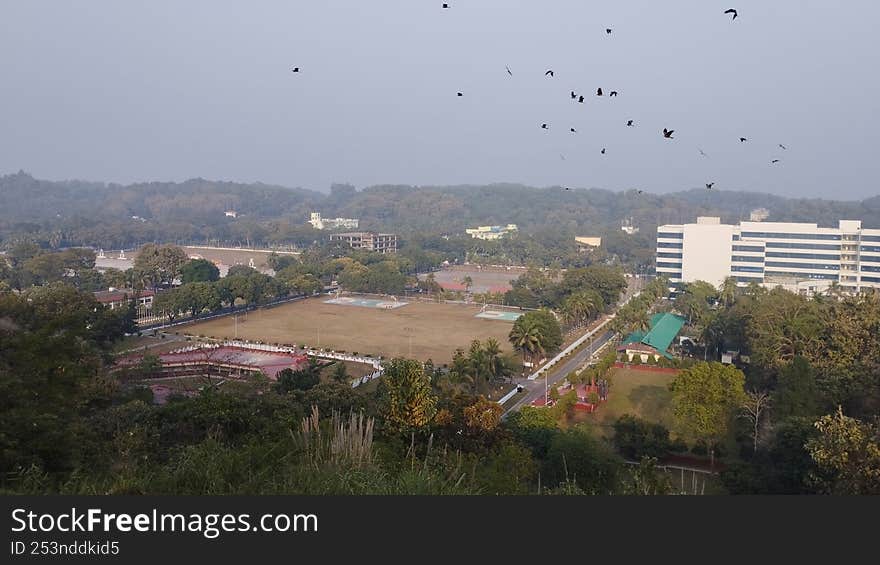 Playground building seen from a distance Eagle hawk flying in the sky