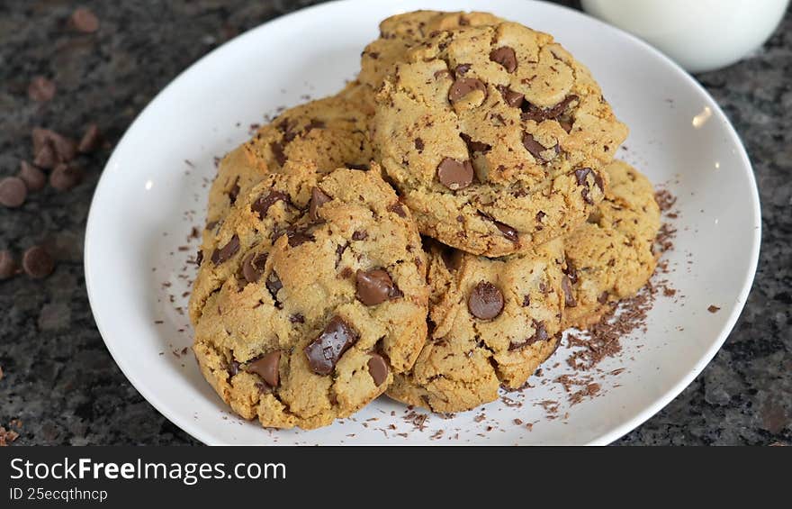 Chocolate chips cookies served in white bowl on the table top, perfect for family gatherings and with tea