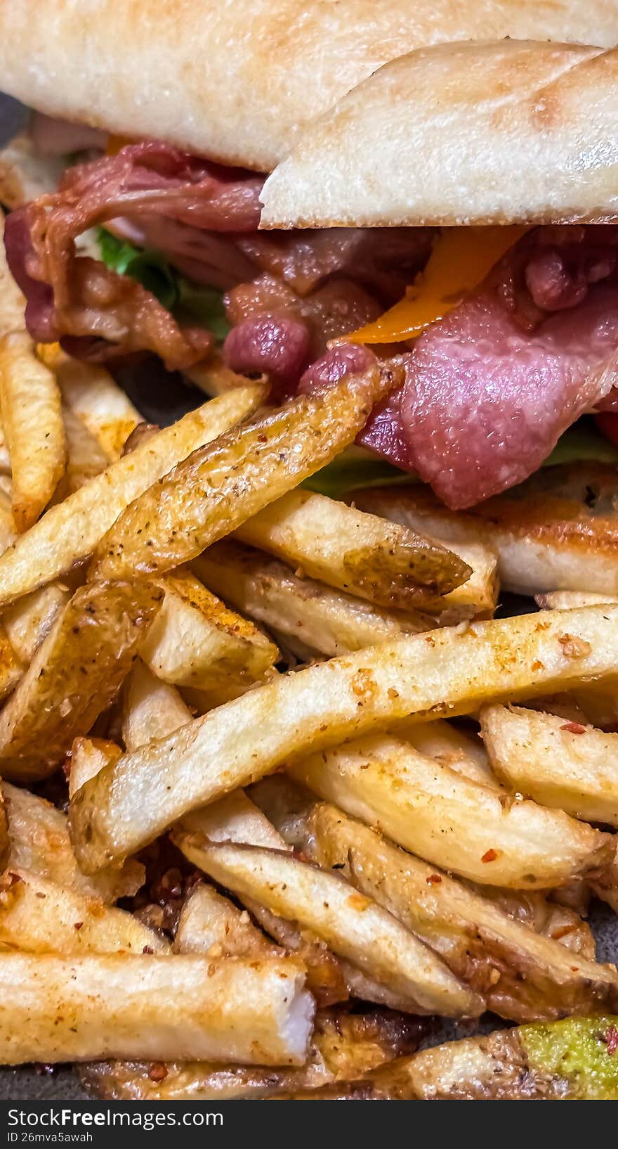 Description: The ultimate winter comfort food. This shot captures a towering turkey club sandwich, layered with crisp bacon, fresh lettuce, and vine-ripened tomatoes on toasted sourdough. Served with a side of hot, salted French fries, it�s a nostalgic nod to small-town Almonte hospitality and the warmth of a local booth during a blizzard.